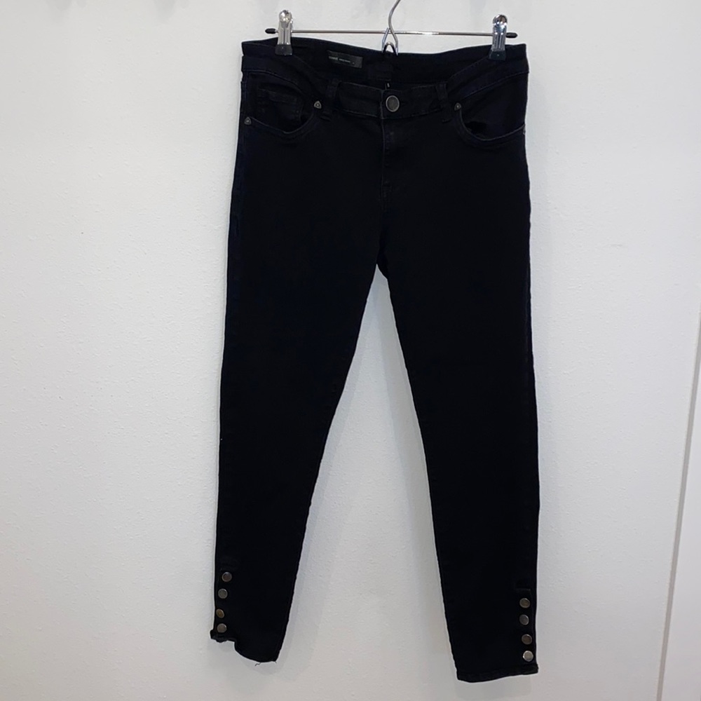 Black straight jeans with ankle snap detailing